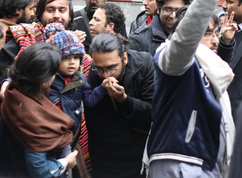 Support pours in for arrested activist after picture with son goes viral