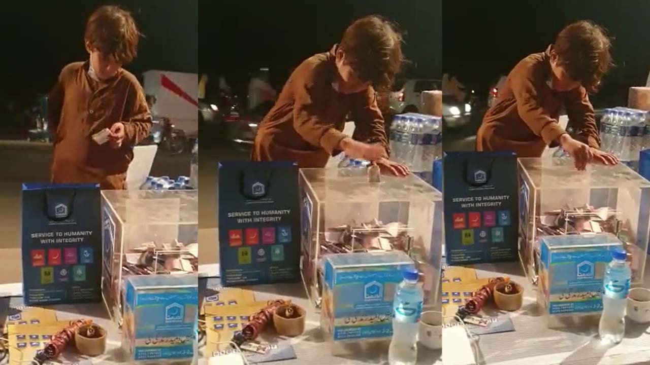 Video: Young shoe polisher wins hearts by donating half of his earnings to flood victims